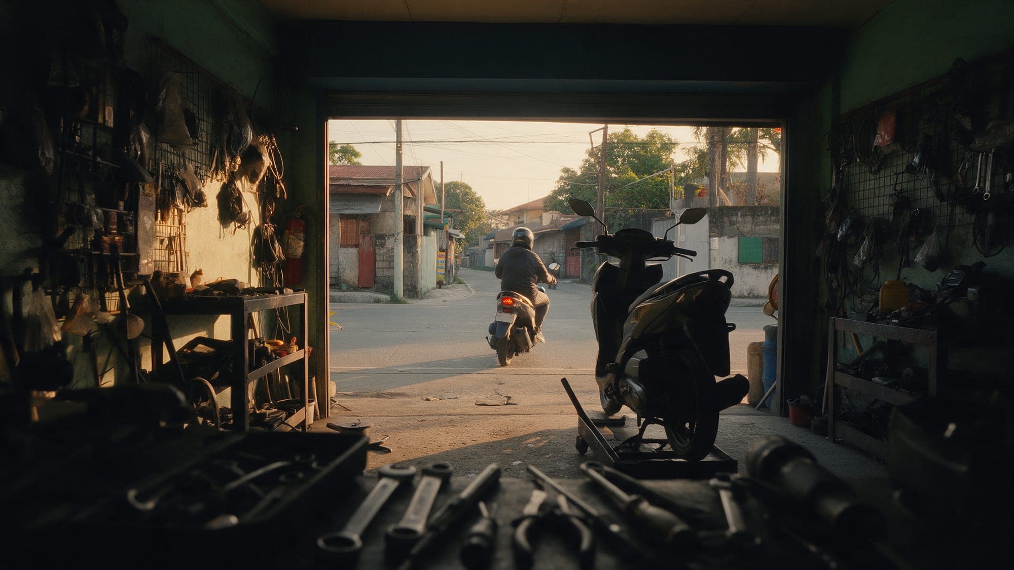 A rider heading out of the shop door on a scooter